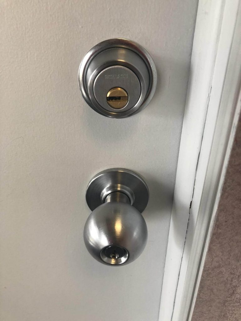 High security Schlage deadbolt and doorknob installed on door in Rochester NY